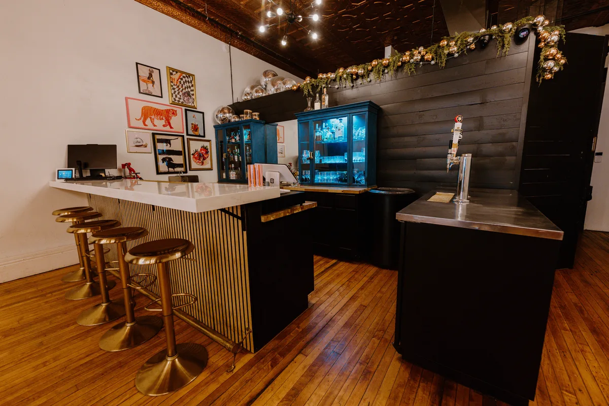The Main Event venue interior with disco balls and warm ambient lighting